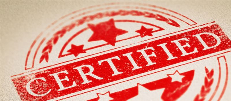 Red “Certified” ink stamp on textured paper