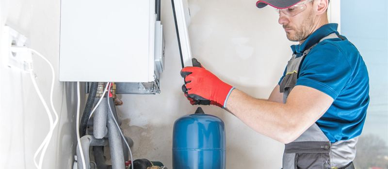 Engineer installing a commercial gas boiler in Coventry | Gas Main Installation Engineer installing a commercial gas boiler in Coventry
